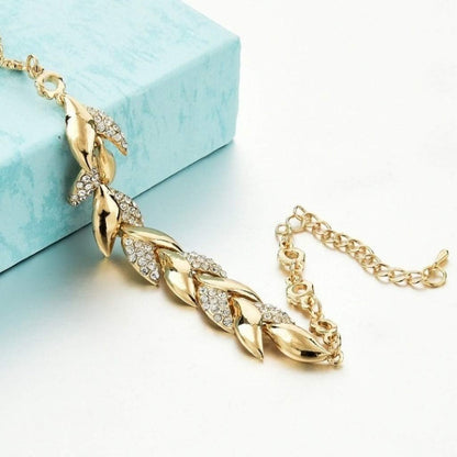 Brazalete Lueur – Cristal y hoja dorada